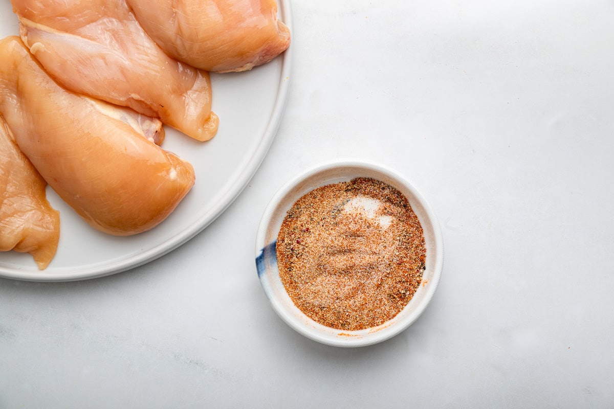 A seasoning blend mixed together in a small white ceramic bowl.