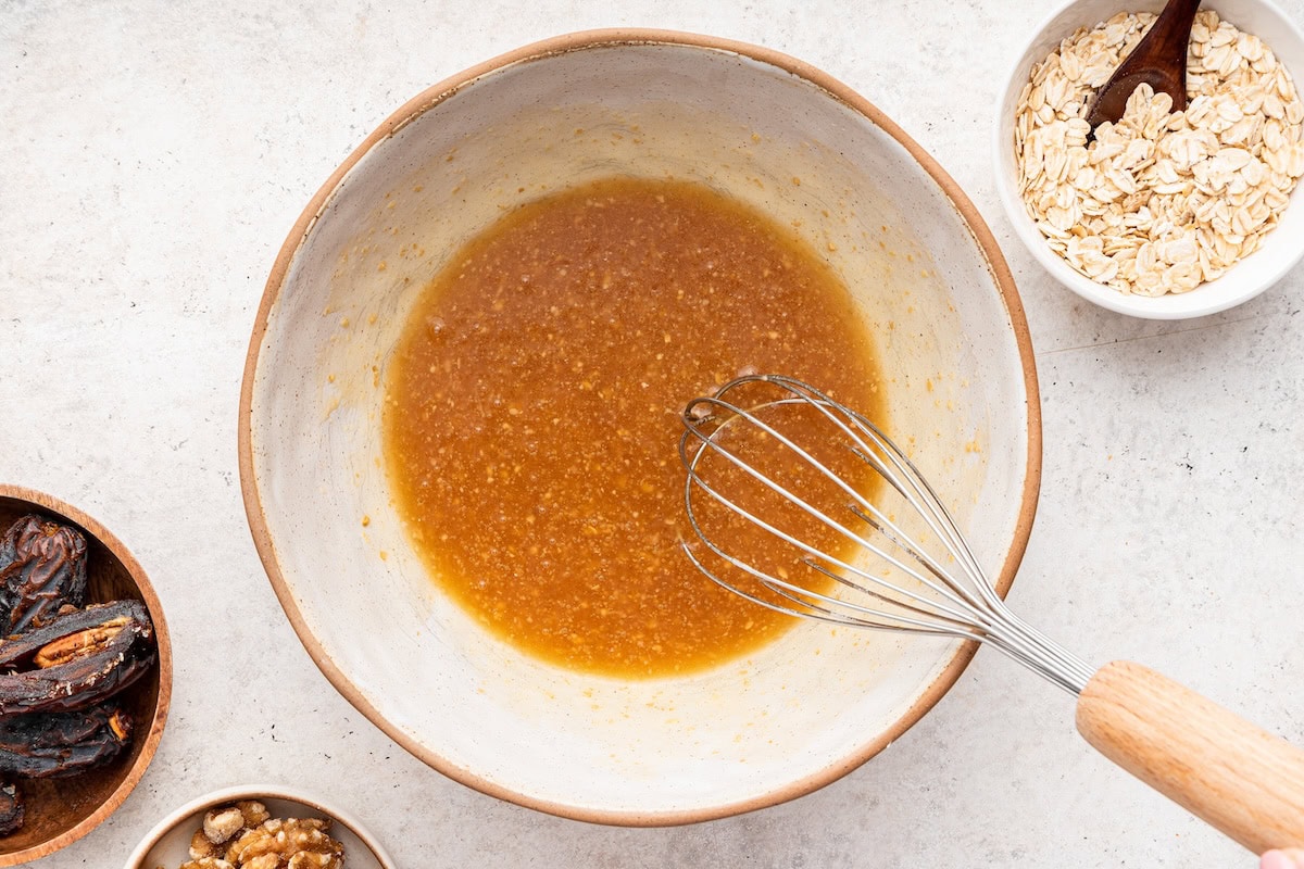 A flax egg mixed together in a small ceramic bowl.