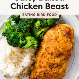 Baked Chicken Breast on a plate with rice and broccoli.