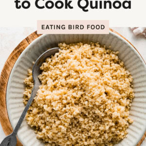 Photo of quinoa in a serving dish with a spoon.