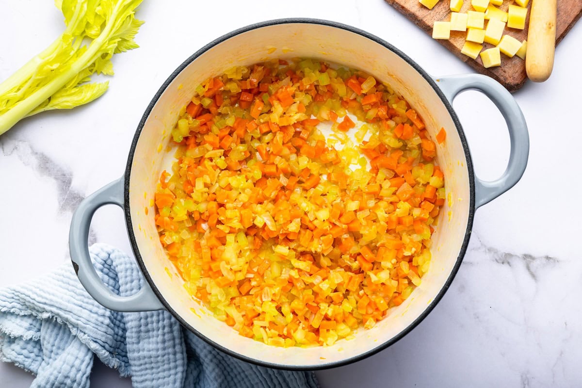 Sautéed carrots, onion, garlic and celery in a large dutch oven pot.