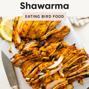 A photo of Chicken Shawarma sliced up on a cutting board with a knife beside of it.