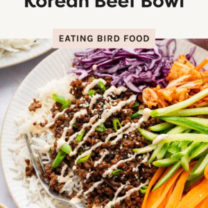 A Korean beef bowl served on a white plate.
