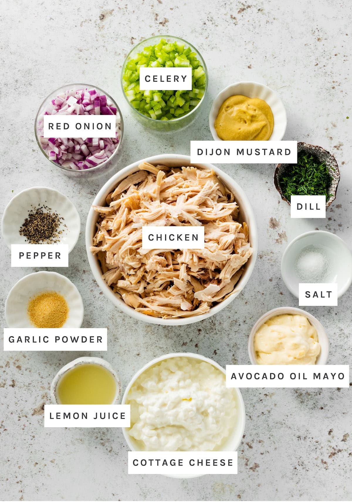 Cottage Cheese Chicken Salad ingredients: Chicken, Celery, Red Onion, Dijon Mustard, Dill, Salt, Avocado Oil Mayo, Cottage Cheese, Lemon Juice, Garlic Powder, Pepper.