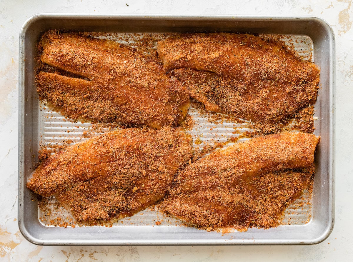 Four tilapia filets coated with the blackened seasoning mixture.