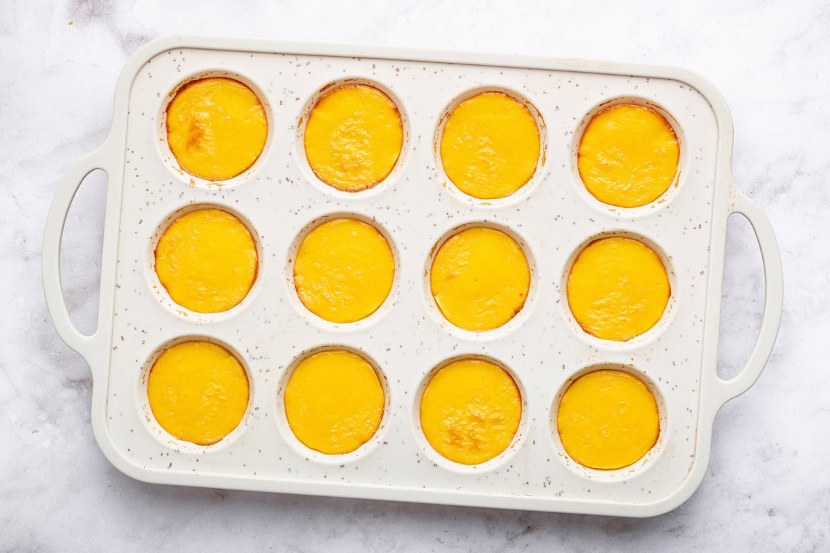 12 cottage cheese egg bites after baking in a silicone muffin tray.