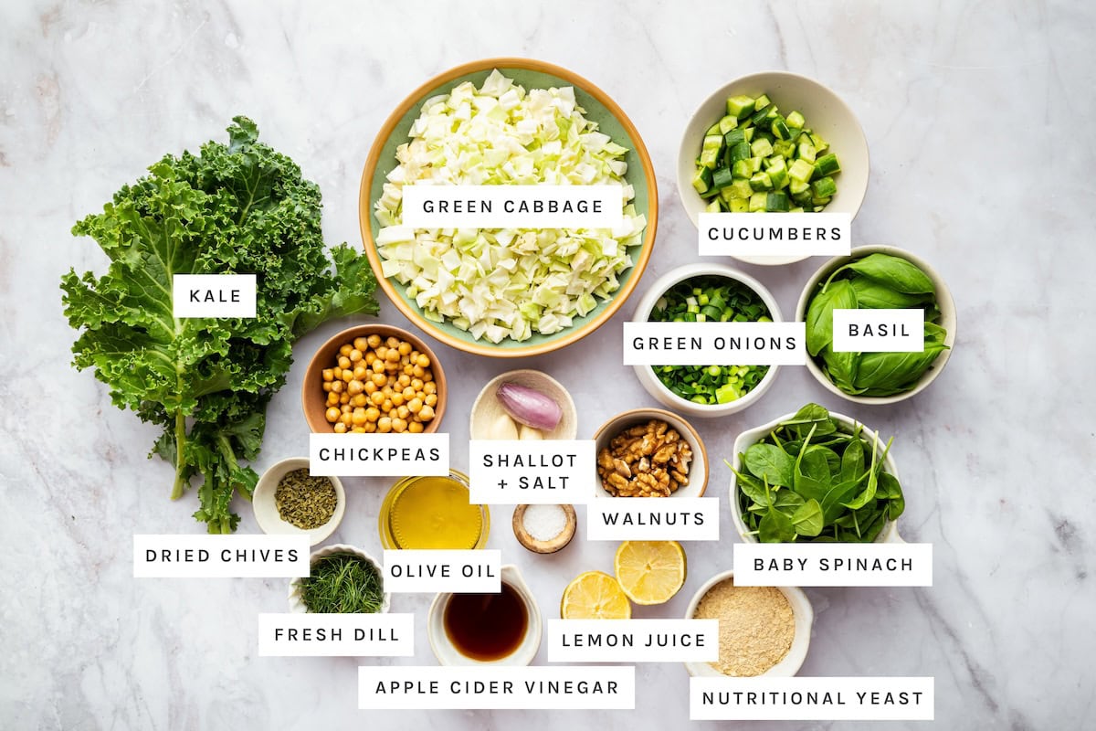Ingredients for the Green Goddess Salad: Kale, Green cabbage, Cucumbers, Green onions, Basil, Chickpeas, Shallot, Salt, Walnuts, Baby spinach, Dried chives, Olive oil, Fresh dill, Lemon juice, vinegar and Nutritional yeast.