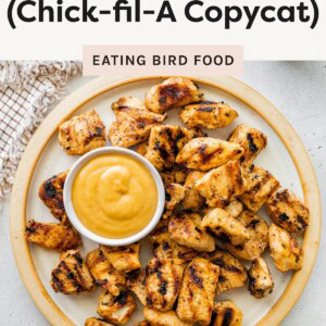 Plate of grilled chicken nuggets served with dipping sauce, labeled as a Chick-fil-A copycat recipe.