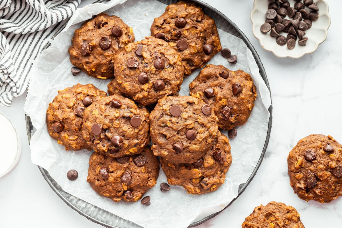 Plate of freshly baked pumpkin oatmeal cookies with chocolate chips.