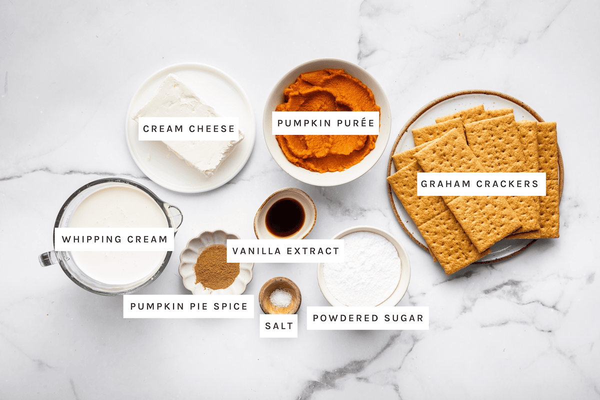 Ingredients for the pumpkin icebox cake: pumpkin puree, cream cheese, graham crackers, powdered sugar, salt, vanilla, pumpkin pie spice and whipping cream.