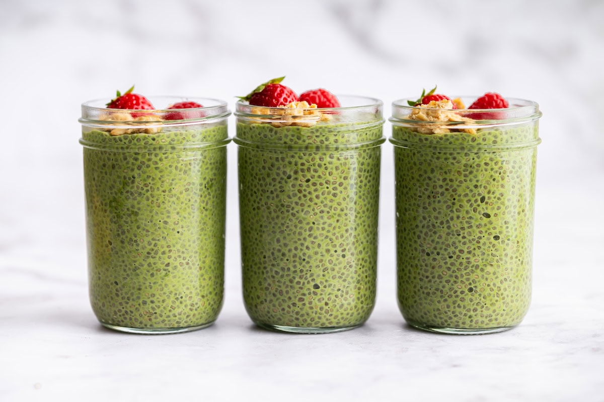 matcha chia pudding recipe Three jars of green matcha chia pudding lined up for easy breakfast meal prep.