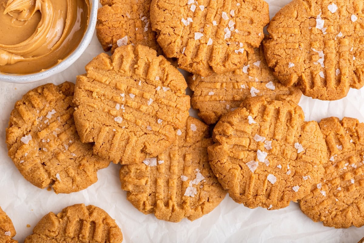 Peanut butter cookies on a piece of parchment paper.