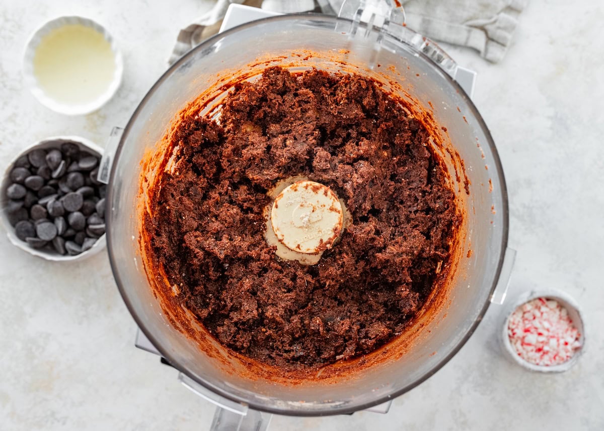 chocolate date mixture Food processor filled with chocolate date mixture for peppermint protein balls.