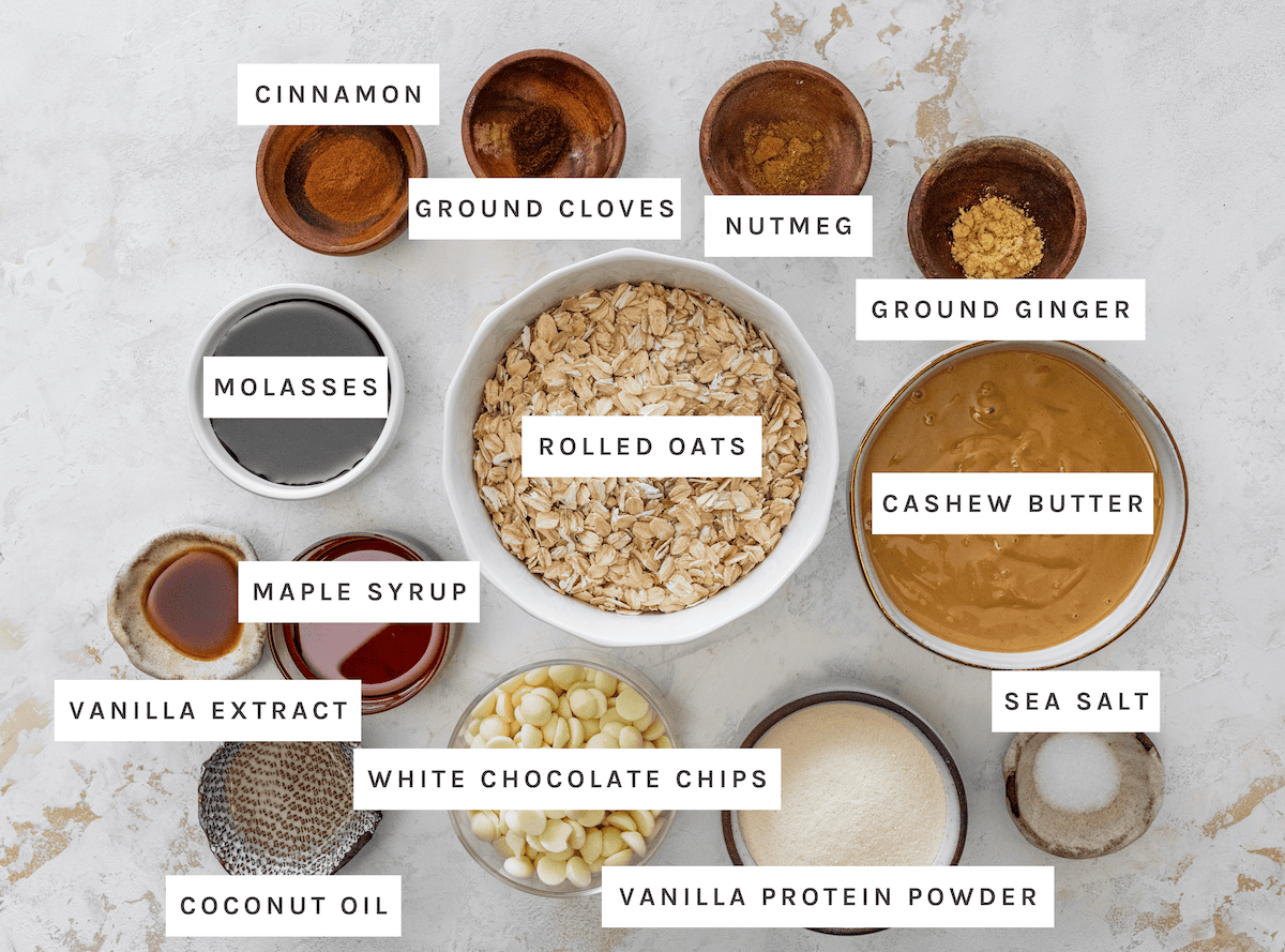 Gingerbread Protein Balls ingredients Cinnamon, Ground cloves, Nutmeg, Ground ginger, Molasses, Rolled oats, Cashew butter, Sea salt, Maple syrup, Vanilla extract, White chocolate chips, Vanilla protein powder, Coconut oil