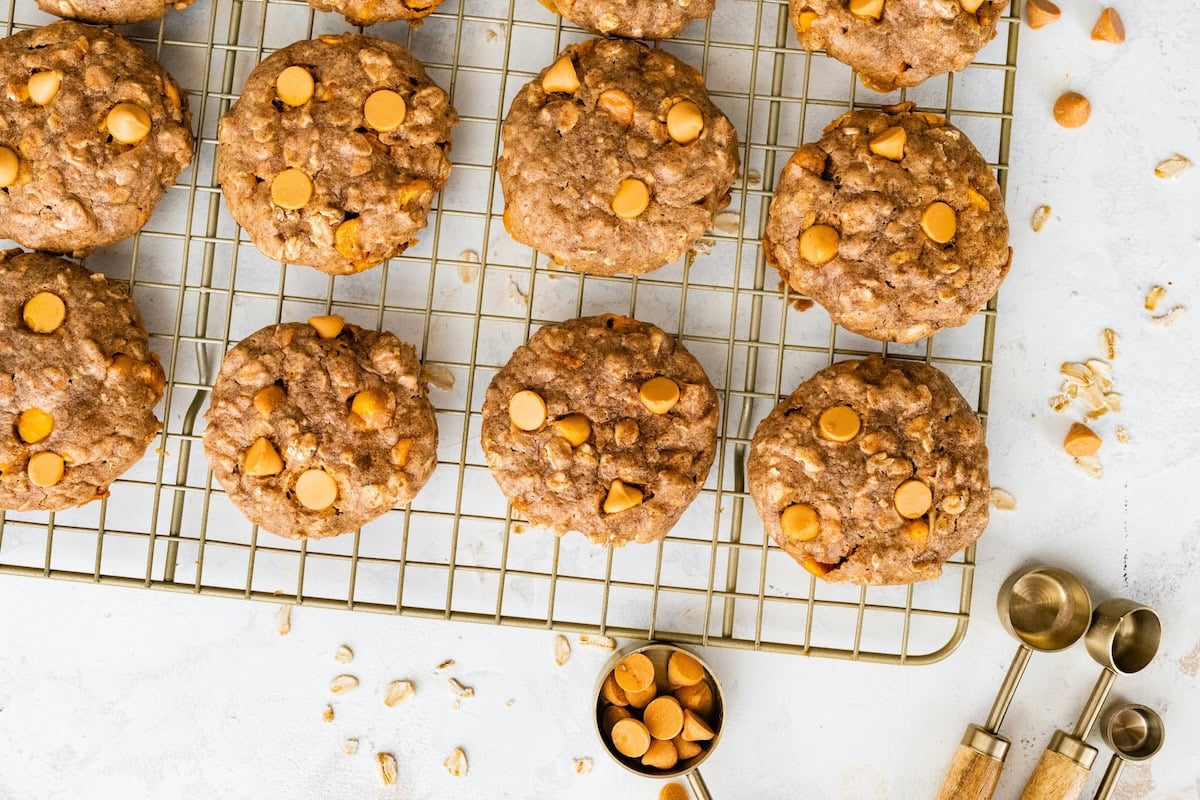 Oatmeal scotchies cookies cooling on a wire rack.