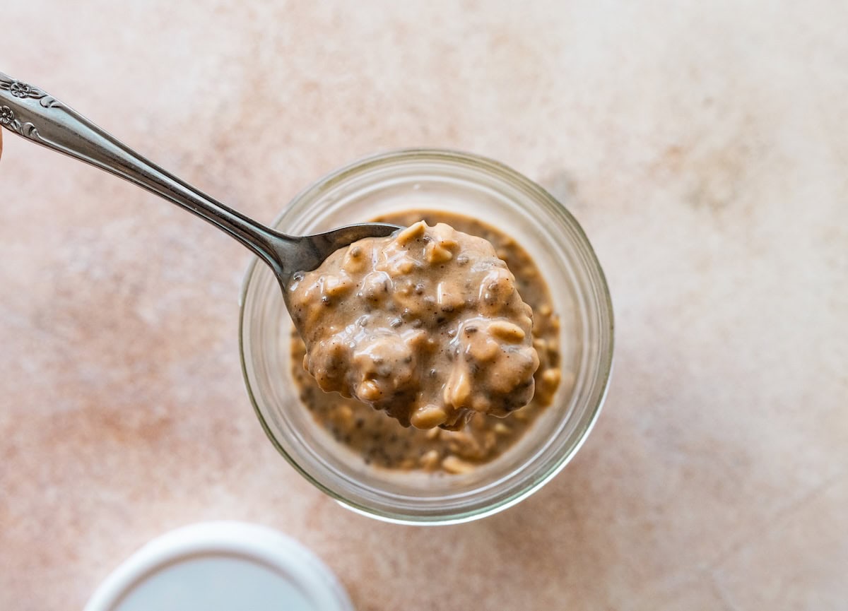 Spoonful of brown sugar espresso overnight oats showing thick creamy texture.