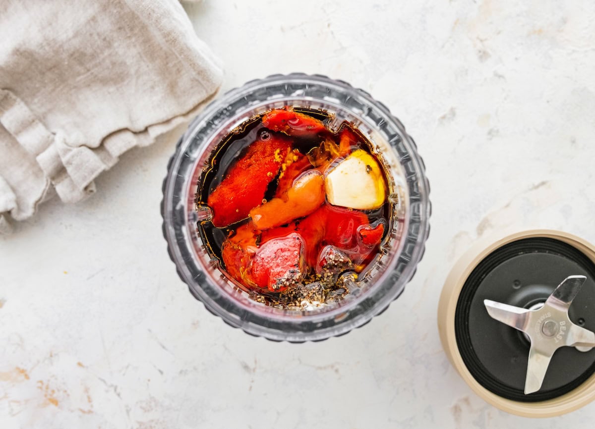 Roasted red peppers, balsamic vinegar, olive oil and garlic blended in food processor to make creamy red pepper dressing.