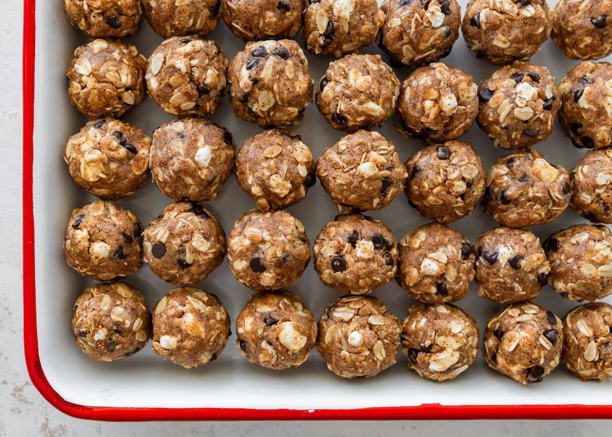 Batch of s’mores protein balls lined up on a baking sheet.