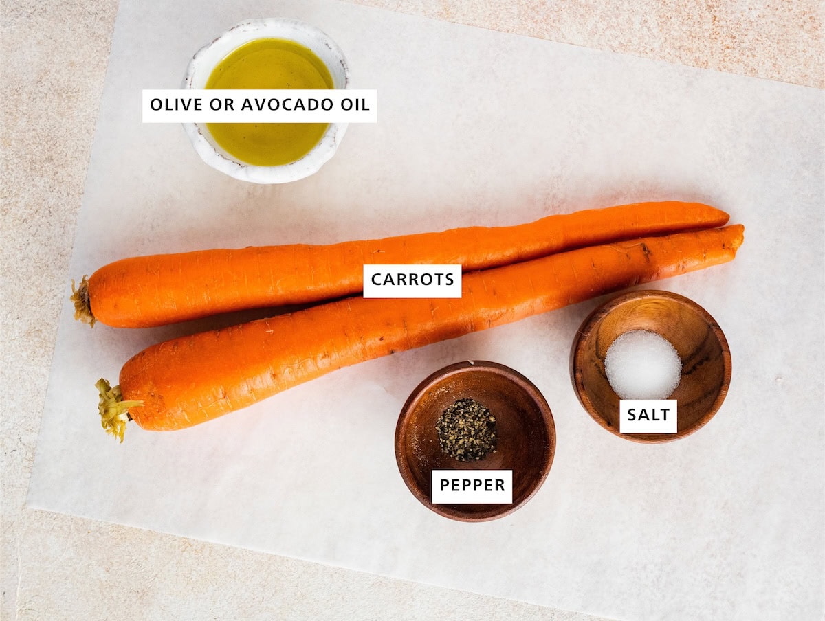 Ingredients measured out to make Air Fryer Carrots: olive oil, carrots, pepper and salt.