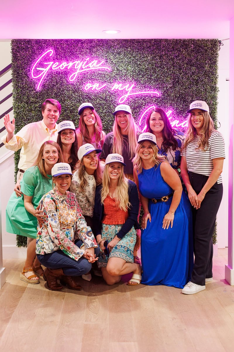Fresh Air Retreat group photo in front of a Georgia on my Mind neon sign.