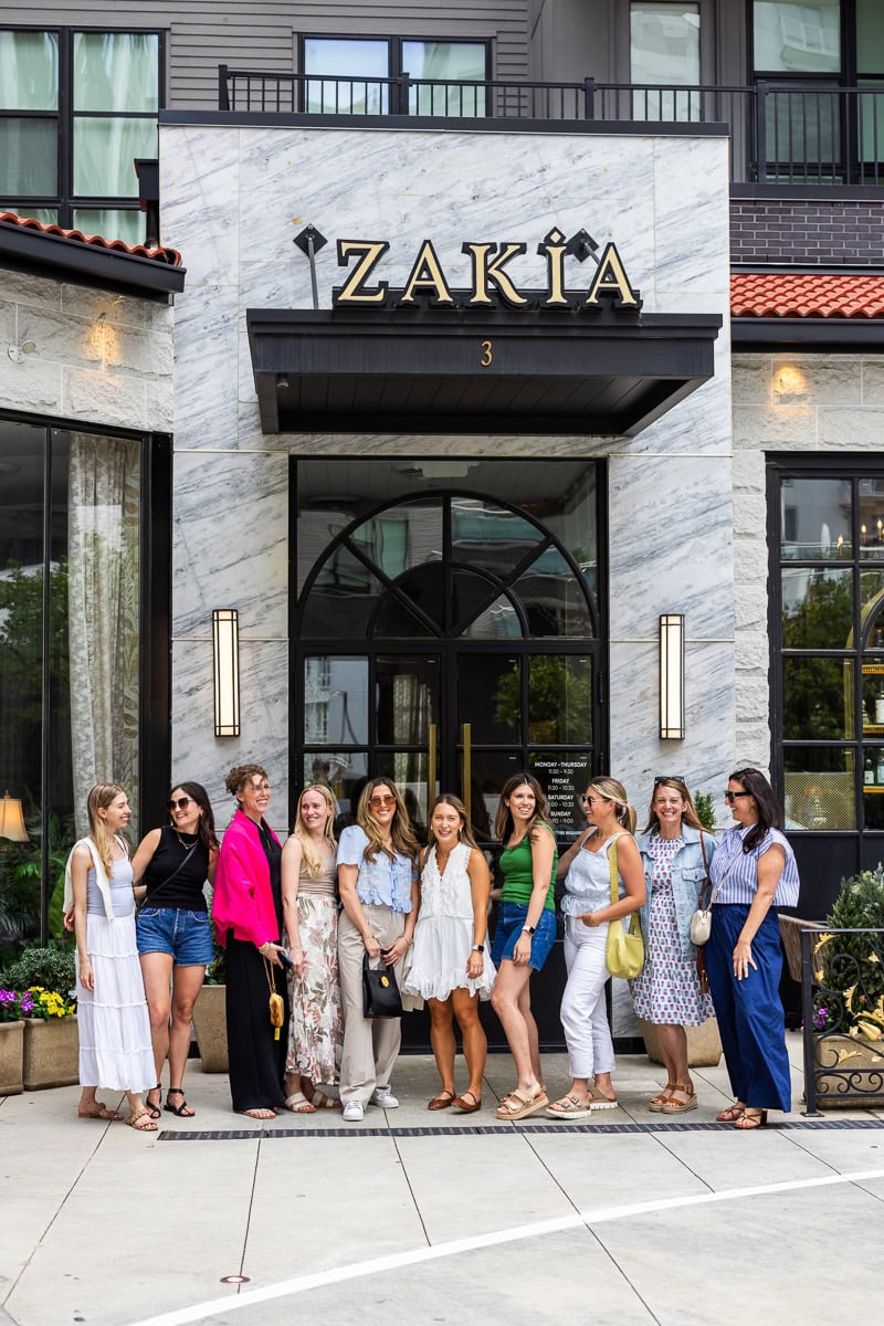 A group of food bloggers posing outside the Zakia restaurant in Atlanta.