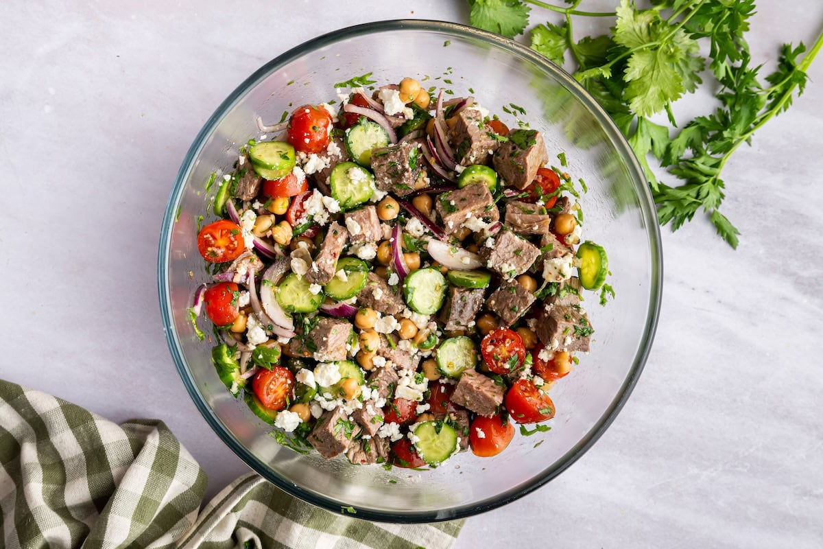 A chimichurri salad in a large glass bowl.