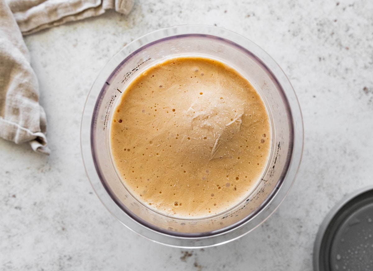 A peanut butter cup blizzard mixture in a pint container after being frozen.